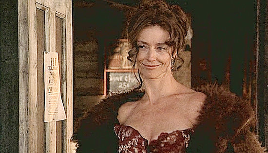 Rachel Ward as Queenie, the whore who will occasionally take stock as payment in Johnson County War (2004)