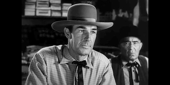 Randolph Scott as Dan Mitchell, determined to see the homesteaders survive in Abilene Town (1946)