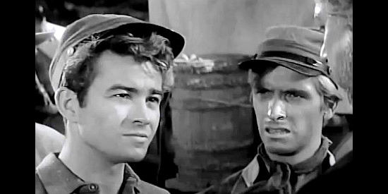 Ray Stricklyn as Jesse James and Rex Holman as Zack confront a Union prisoner in Young Jesse James (1960)