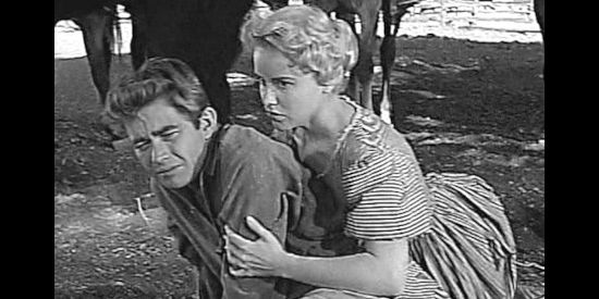 Ray Stricklyn as Jesse James, consoled by Zee Mimms (Jacklyn O'Donnell) after his father's hanging in Young Jesse James (1960)