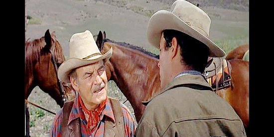 Ray Teal as Ralph Taggart, learning of Ben Blazer's plans to keep him from building a ranch nearby from son Kent in Taggart (1964)