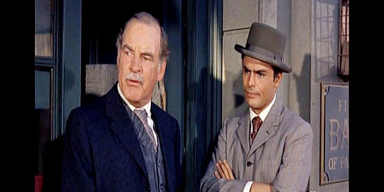 Ray Teal as the banker Rossom with Seymour Kern, an Easterner under his employ in Posse from Hell (1961)