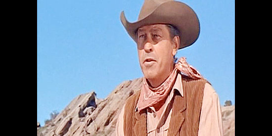 Regis Parton as Curly, a would-be bushwhacker planning an ambush for Lee Travers in Arizona Bushwhackers (1968)