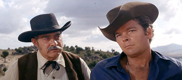 Renato Polselli as Sheriff Litton, wondering if there's more good or bad in Johnny Ketchum in Son of a Gunfighter (1965)