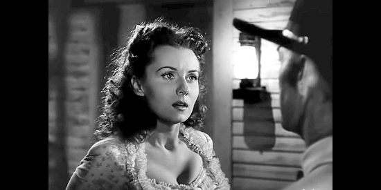 Rhonda Fleming as Sherry Balder, the woman who loves Dan but hates the way he keeps putting himself in danger in Abilene Town (1946)