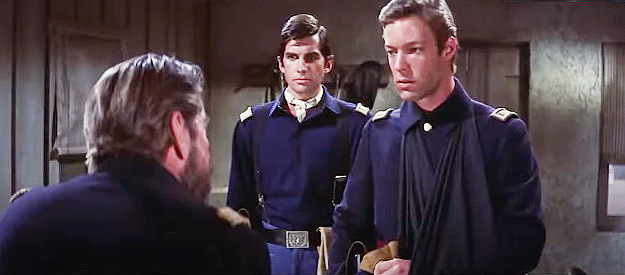 Richard Chamberlain as Lt. Porter receiving a tongue lashing from his captain as Lt. McQuade (George Hamilton) looks on in A Thunder of Drums (1961)