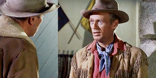Richard Widmark as Lt. Jim Gary, standing up to Guthrie McCabe's money-hungry ways in Two Rode Together (1961)