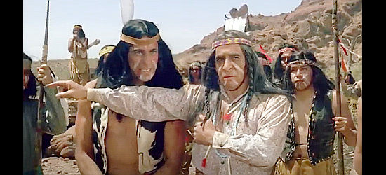 Robert Carricart as Kai-La, the Apache chief holding back a young brave in Blood on the Arrow (1964)