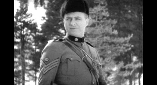 Robert Elliott as Sgt. Mooney, the investigator trying to find the man who's stealing gold in Men of the North (1930)