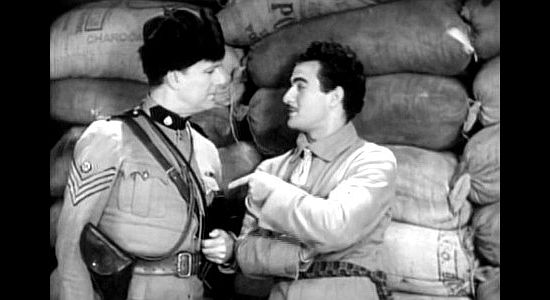 Robert Elliott as Sgt. Mooney, trying to catch Louis La Bey (Gilbert Roland) in a lie in Men of the North (1930)