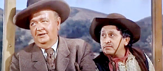 Robert Emhardt as R.C. Crawford and Pedro Gonzales as Angel Dominguez, aboard McCool's prison wagon in Hostile Guns (1967)