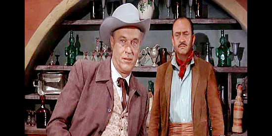 Robert J. Wilke as Johnny Flanders, in a dispute with an estranged partner as Miguel (Rodolfo Hoyos Jr.) looks on in The Gun Hawk (1963)