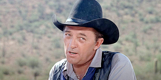 Robert Mitchum as Ben Kane, issuing a warning to Billy Young in Young Billy Young (1969)