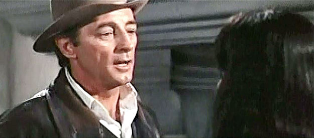 Robert Mitchum as Lee Arnold, explaining his mercenary attitude to Fina in Villa Rides (1968)