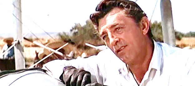 Robert Mitchum as Lee Arnold, forced to use a borrowed airplane to help the revolutionaries in Villa Rides (1968)