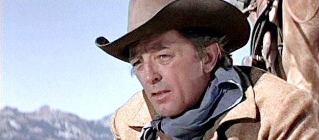 Robert Mitchum as Marshal Flagg, learning that trouble might be headed toward Progress in The Good Guys and the Bad Guys (1969)
