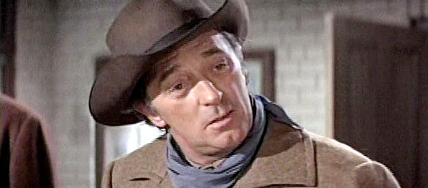 Robert Mitchum as Marshal Flagg, trying to convince the mayor to form a posse to hunt down McKay in The Good Guys and the Bad Guys (1969)