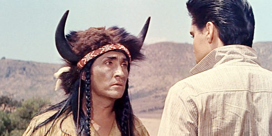 Rodolfo Acosta as Buffalo Horn, questioning Pacer (Elvis Presley) about his allegiance to the Kiowa in Flaming Star (1960)