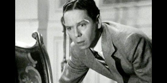 Roger Pryor as the Tiger Kid, knowing something has gone horribly wrong in Belle of the Nineties (1934)