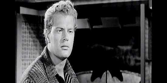 Roger Torrey as Mule Thompson, wondering if it's time for he and his buddies to leave Trail City in The Plunderers (1960)