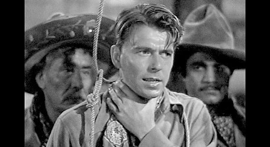 Ronald Reagan as Gil Jones, in danger of being hanged by Pancho Lopez in The Bad Man (1941)