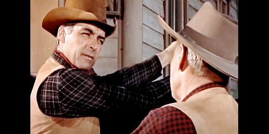 Rory Calhoun as Clint McCoy, being invited to leave town by Sheriff Jenkins in Young Fury (1965)