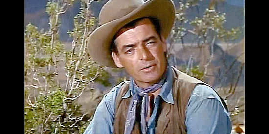 Rory Calhoun as Jim Walker, the veteran frontiersman who warns of Apache trouble in Apache Uprising (1966)