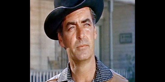 Rory Calhoun as Santee, arriving in Lark determined to turn it back into a wide-open town in Black Spurs (1965)