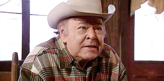 Roy Clark as one of the old timers haring the story of the Palo Pinto shootout in Palo Pinto Gold (2009)