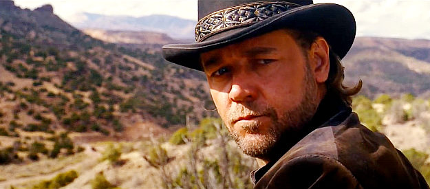 Russell Crowe as Ben Wade, hearing a strange gunshot in the distance in 3:10 to Yuma (2007)