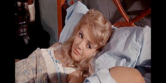 Ruta Lee as Marleen, waking from a night in Blaine Madden's bed in The Gun Hawk (1963)