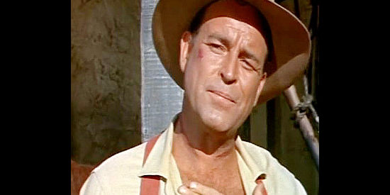 Scott Brady as Rev. Tanner, showing the scar around his neck from when he was nearly hanged in Black Spurs (1965)