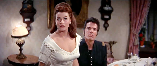 Senta Berger as Lou Woddard and Tom Tyron as Capt. Demas Harrod have their romantic dinner interrupted in The Glory Guys (1965)