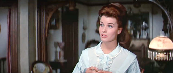 Senta Berger as widow Lou Woddard, explaining the need for discretion to Demas Harrod in The Glory Guys (1965)