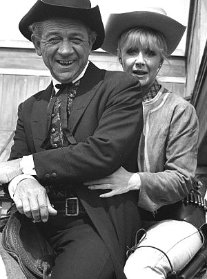 Sidney James as the Rumpo Kid and Angela Douglas as Annie Oakley in Carry on Cowboy (1966)