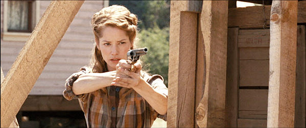 Sienna Guillory as Jane Taylor, hardly gunless in Gunless (2010)