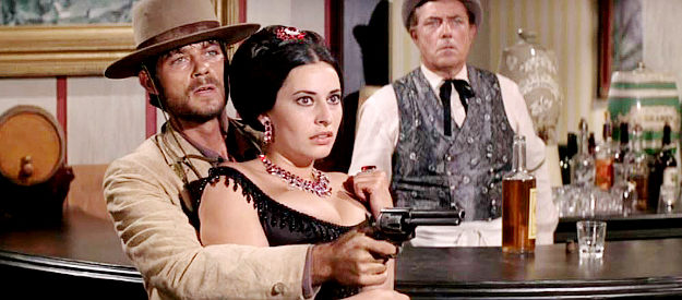 Solomon Sturges as Billy Roy Hackett using Tracey Winters (Ina Balin) as a human shield in Charro! (1969)