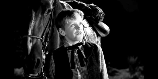 Stephen Grant as Johnny Worth, having saddled a horse for Quirt Evans in Angel and the Badman (1947)