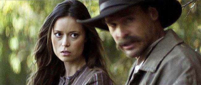 Summer Glau as Maggie Moon with her father after bandits have hit their home in The Legend of Hell's Gate (2011)