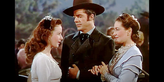 Susan Hayward as Lucy Overmire, Dana Andrews as Logan Stuart and Patricia Roc as Caroline Marsh in Canyon Passage (1946)