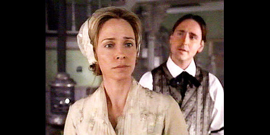 Susanna Thompson as Amy Kane, learning about her husband's past from a hotel clerk in High Noon (2000)