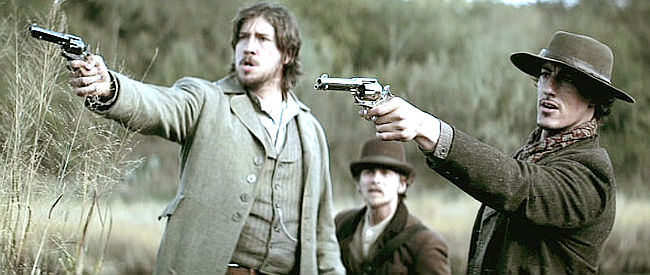 Tanner Beard as James McKinnon, Lou Taylor Pucci as Kelly and Eric Balour as Will Edwards, spooked by a noise in the brush in The Legend of Hell's Gate (2011)