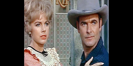 Terry Moore as Anna and James Best as her husband Sheriff Ralph Elkins, fearful of Santee's next move in Black Spurs (1965)