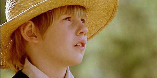 Thomas Curtis as Benjo Yoder, Rebecca's young son, intrigued by the stranger Johnny Gault in The Outsider (2002)