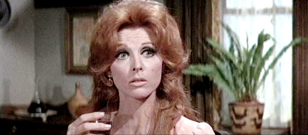 Tina Louise as Carmel, a married woman being plied with liquor by the mayor of Progess in The Good Guys and the Bad Guys (1969)