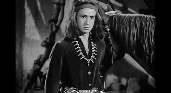Tito Renaldo as Cochee, the young Indian helper at Tom Folliard's stage station in Apache Trail (1942)