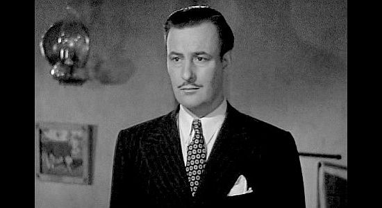 Tom Conway as Morgan Pell, the rich land speculator Lucia has married in The Bad Man (1941)