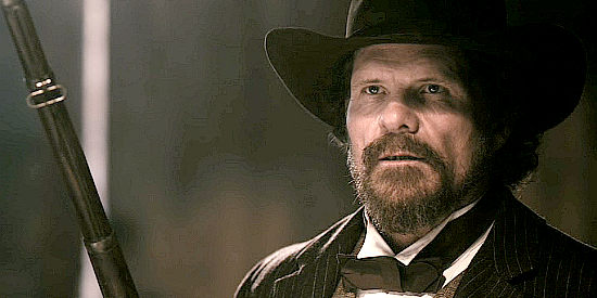 Tom Proctor as Sheriff Ashplant, a man who rules with an iron fist in Heathens and Thieves (2012)