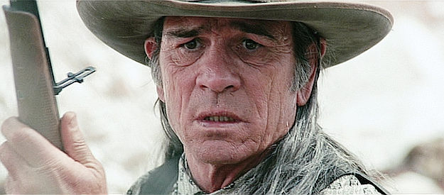 Tommy Lee Jones as Samuel Jones, realizing the Indians have sensed his planned ambush in The Missing (2003)