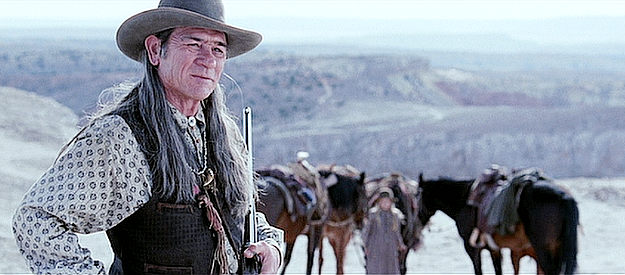 Tommy Lee Jones as Samuel Jones, welcoming an old friend to the hunting party in The Missing (2003)